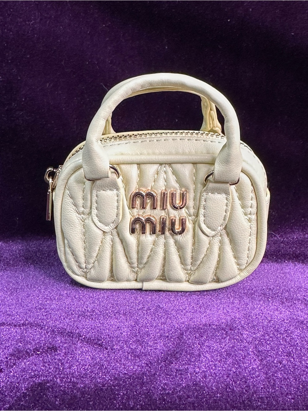 pale yellow quilted mini bag with a judgmental look 🐥